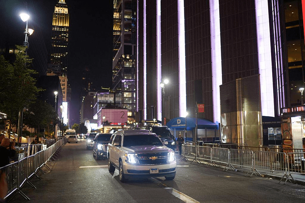 Chauffeur assisting guests at an airport transfer pickup
